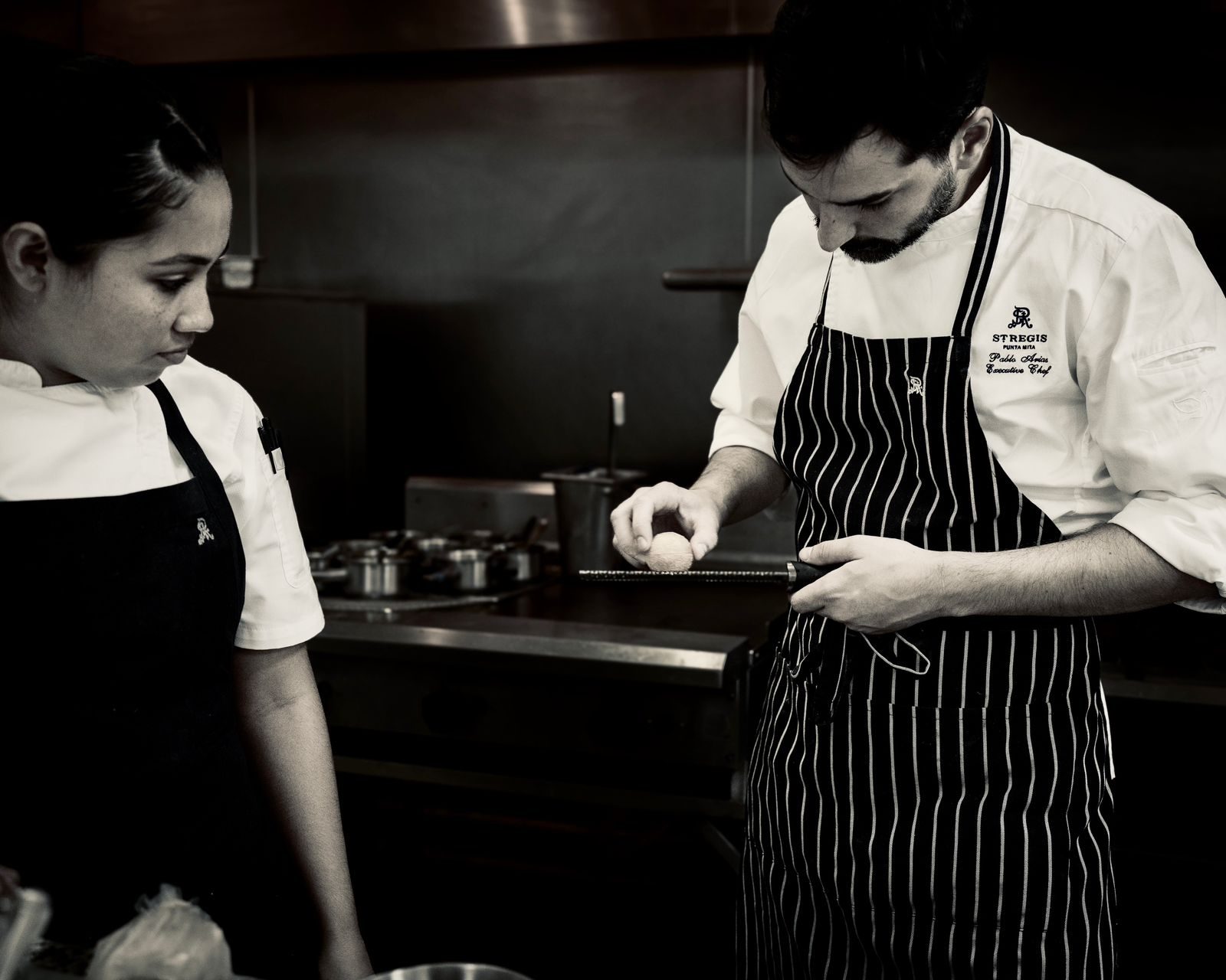 Pablo Arias in the kitchen with a cook