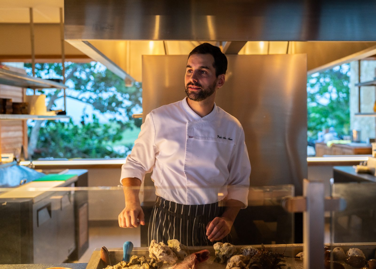 Pablo Arias at the open kitchen pass